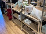 a room with a lot of shelves and a lot of items on it