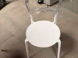 a white chair that is sitting in a room