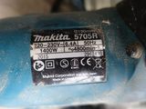 a close up of a blue machine with a label on it