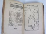 an open book with a drawing of a star on it