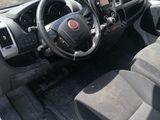 the interior of a car with a steering wheel and dashboard
