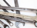 many wrenches that are sitting on a table
