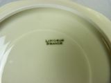 a white plate that has a green label on it