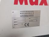 a machine that is sitting on the ground in the room