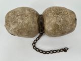 a ball and chain attached to a rock