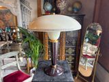 a lamp that is sitting on a table in a room