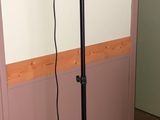 an image of a hair dryer on a stand in the corner of a room