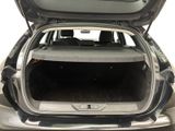 the back of a car with the trunk open and the back seat down