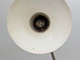 a white light that is on top of a metal pole
