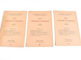 three pamphlets of various types of paper on a white surface