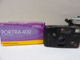 two cameras sitting next to each other on a table