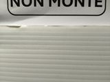 a sign that says non teste / non monte on the side of a refrigerator