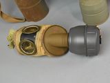 a gas mask and a gas can sitting on a table