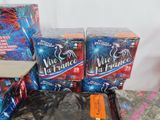 several boxes of fireworks are sitting on a table next to a box of fireworks
