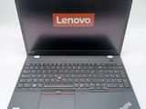 a laptop with a lenovo logo on the screen