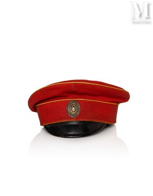an image of a red hat with a gold emblem on it