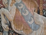 a tapestry with a picture of a woman holding a guitar