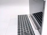 a laptop computer sitting on top of a white table