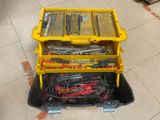 a yellow tool box with tools in it on the floor