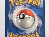 a close up of a pokemon card on a white surface