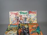 several comics are stacked on top of each other on a table