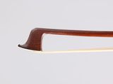 a close up of a violin bow on a white background