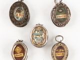 quatre fermoirs en argent et émail, ornés de motifs variés
