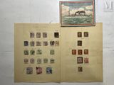 an open book with stamps and a picture of a ship on it