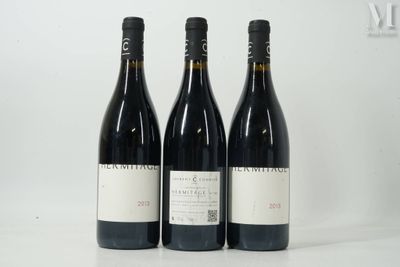 three bottles of wine sitting next to each other on a table