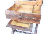 a small wooden box with a mirror on top of it
