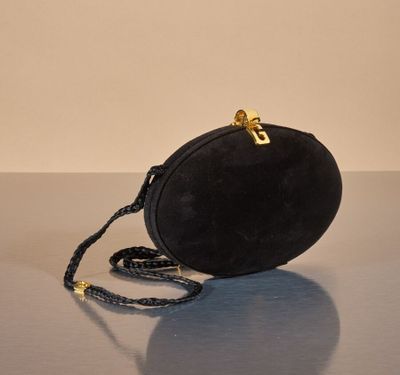 an image of a black purse on a table