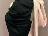 a black and pink shawl draped over a mannequin mannequin mannequin mannequin mannequin mannequin mannequin manne