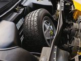 a close up view of a car engine with its hood open