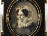 an old picture of a woman with a veil on her head
