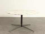 an image of a white marble table with a black metal base
