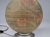 a small globe with a cord attached to it