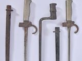 four different types of old tools are displayed on a white surface