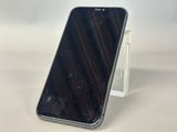 a close up of a cell phone on a stand on a table