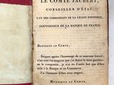 un livre avec une couverture rouge ornée d'une bande blanche