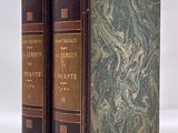 the two books are sitting side by side on a white surface