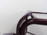 a metal bed frame with a wooden foot board