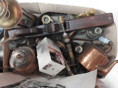 a box full of old copper pots and pans