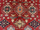 a red rug with many different colors and designs on it