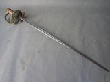 a long sword with a metal handle on a white surface