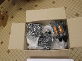 a box with a bunch of items in it on the floor