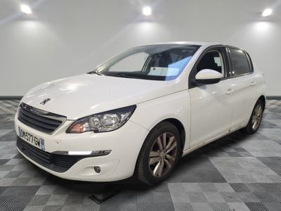 the white car is parked on a checkered floor in the garage