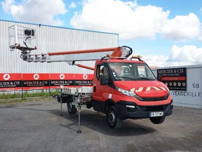 a red truck that is parked in front of a building