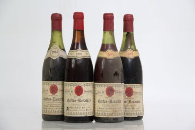 three bottles of wine are lined up in a row on a table