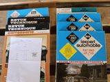 several books on a wooden table with a car in the background
