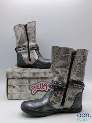 two pairs of women ' s boots with buckles and a snake skin pattern